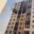 Black smoke poured from the windows of the building as the fire raged